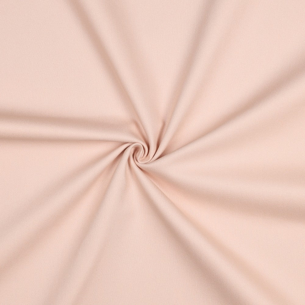 Licht roze spijkerstof met lichte stretch.