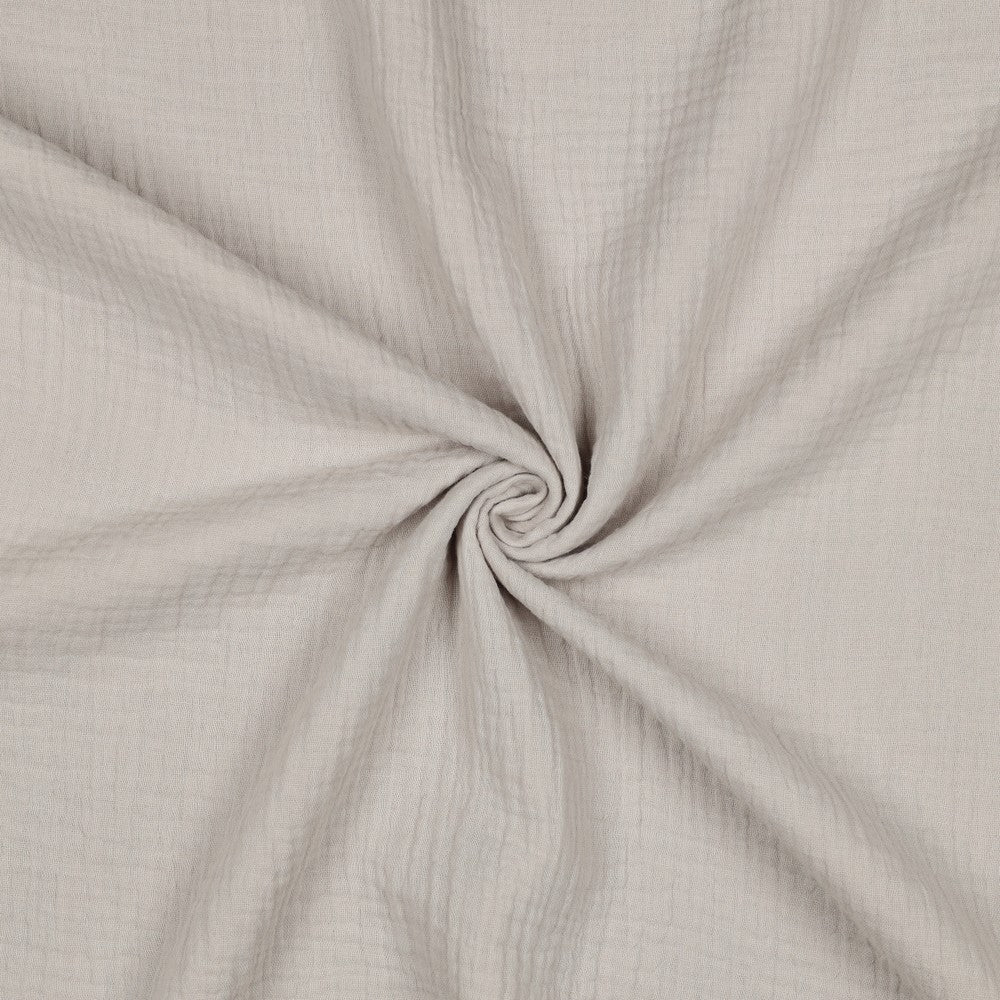 Effen zand beige hydrofiel stof met luchtige structuur