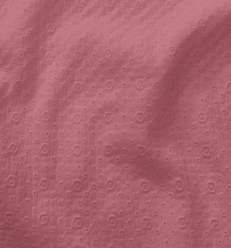Rose kleurige hydrofiel met geborduurde bloemetjes.