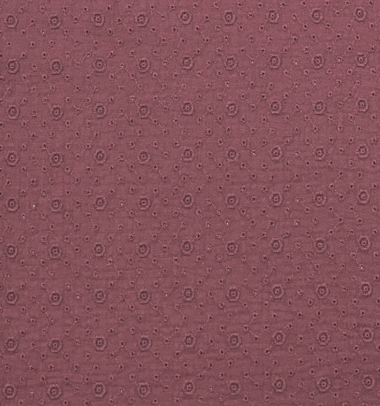 Hydrofiele stof met geborduurde bloemetjes in de kleur mauve paars.