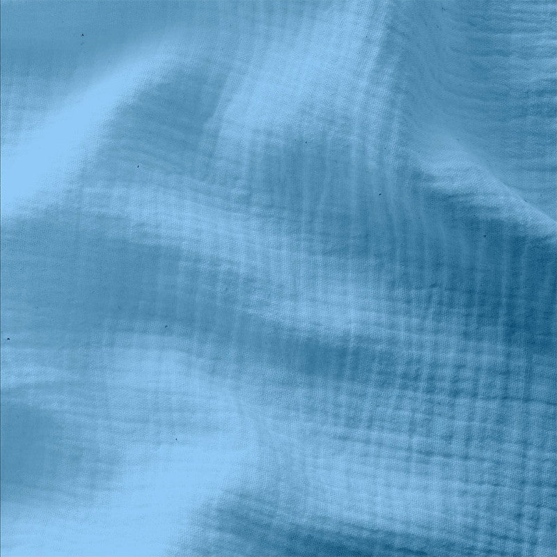 Donker baby blauwe double gauze stof voor het maken van bijvoorbeeld babykleding of kinderkleding.