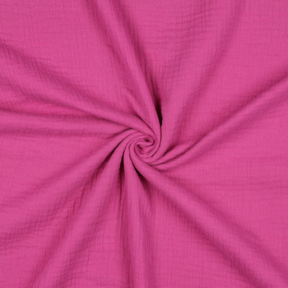 Uni cerise paarse double gauze of hydrofiel voor bijvoorbeeld zomerkleding of kinderkleding.