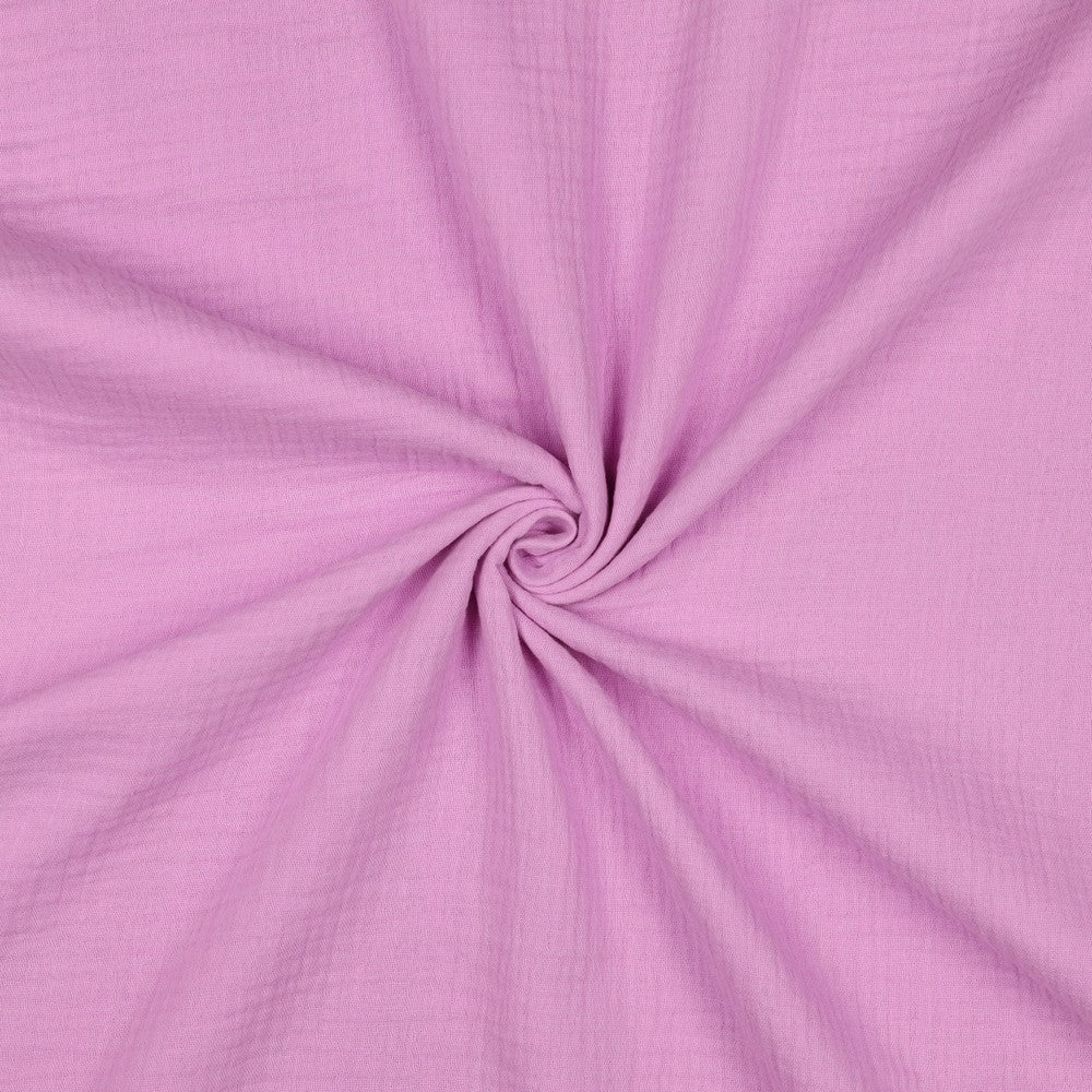 Licht roze hydrofiel of ook wel double gauze voor bijvoorbeeld een zomerjurk of kinderkleding.