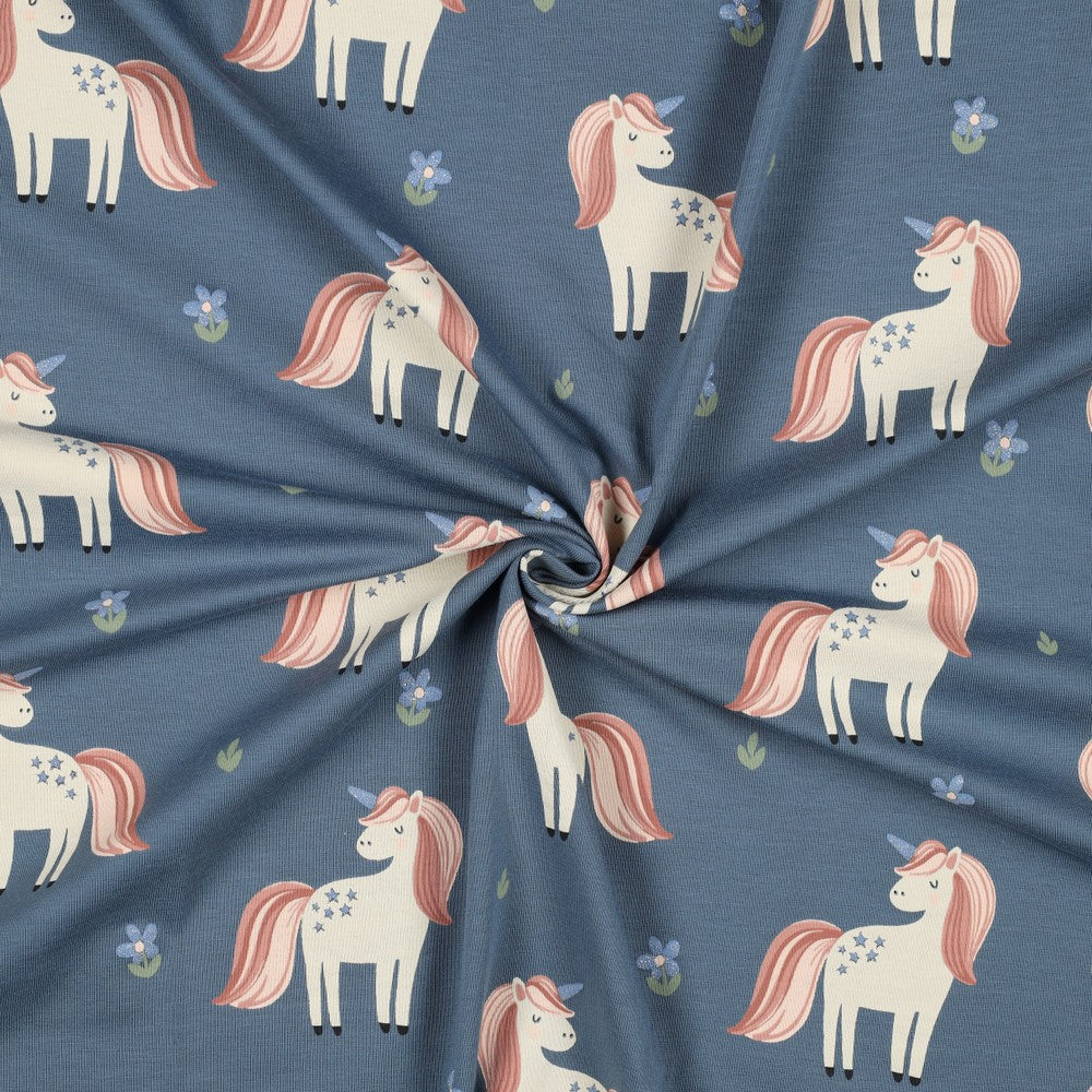 Blauwe tricot met unicorn en glitter.