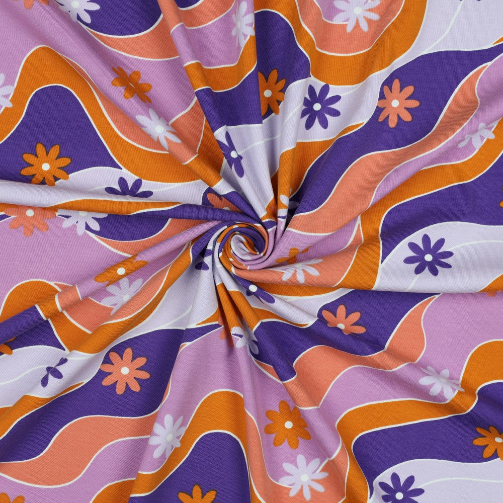 Retro print tricot met paars en oranje golven en bloemen voor bijvoorbeeld een jurk of shirt voor meisjes.