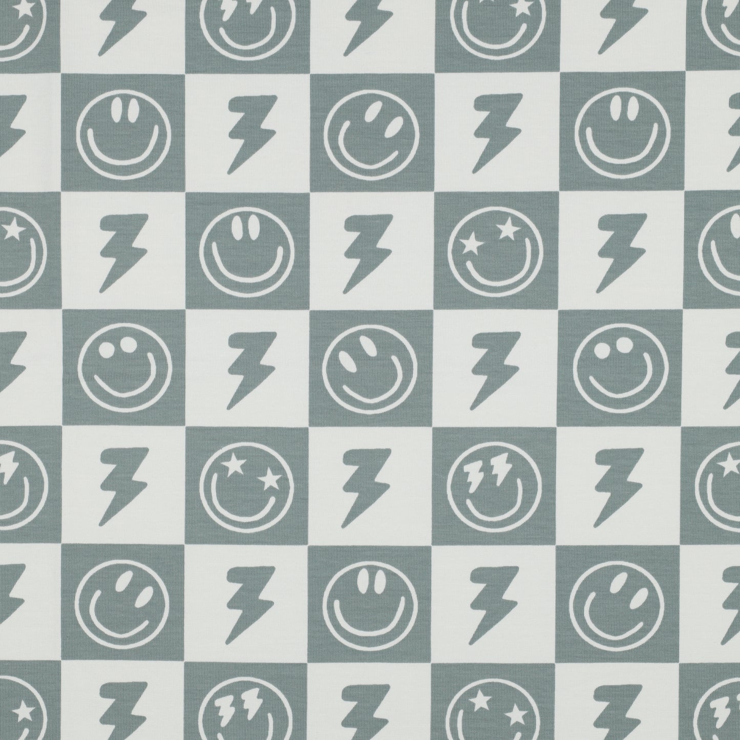 Tricot met blokjes en smiley's in de kleuren gebroken wit met salie groen.