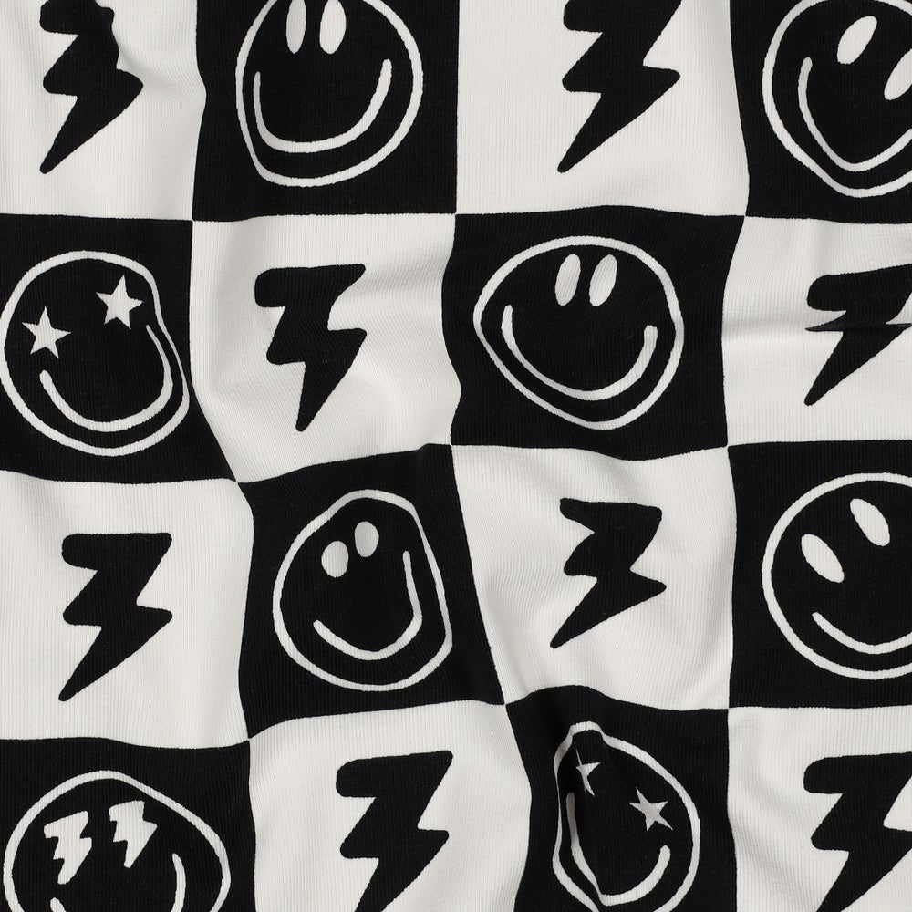 
                  
                    Tricot met blokjes en smiley in zwart wit voor een shirt of korte broek.
                  
                