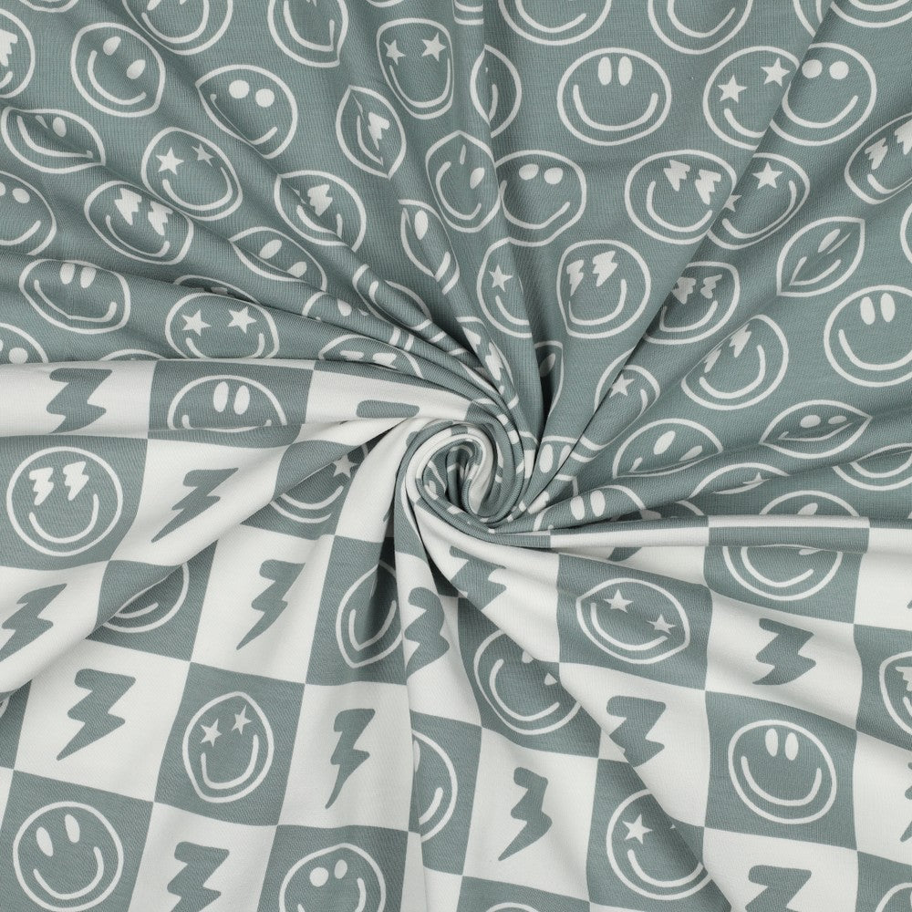 
                  
                    Sage blokjes en smiley combinatie voor bijvoorbeeld zomerkleding of een pyjama voor jongens.
                  
                