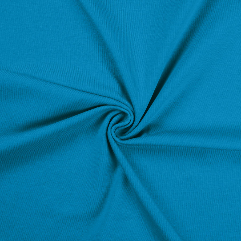 Turquoise blauwe uni katoenen tricot stof.