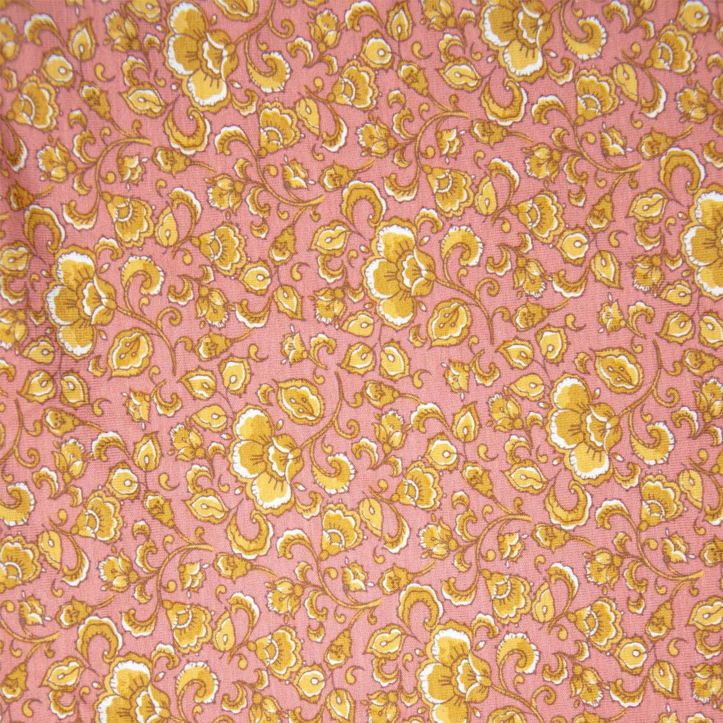 Donker zalm kleurige jersey viscose met gele bloemenprint.