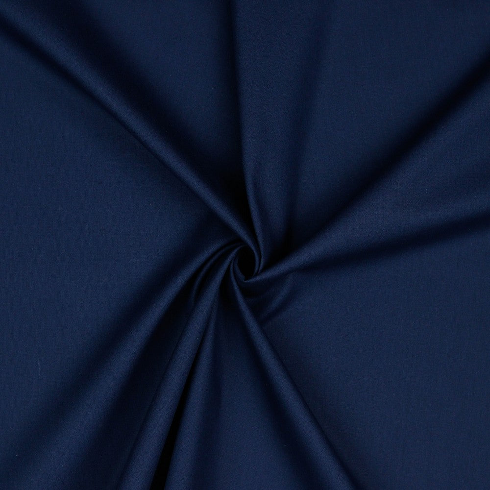 Navy blauwe uni katoenen poplin.
