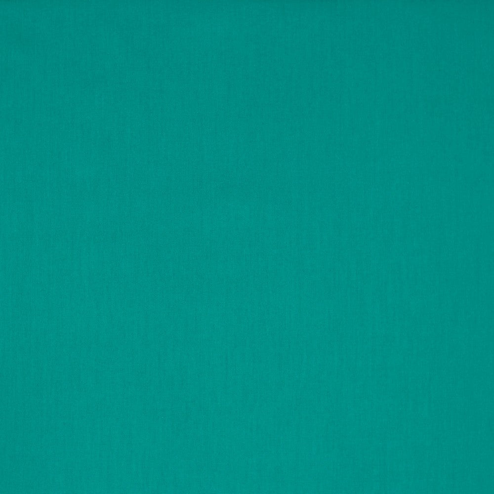 
                  
                    Turquoise kleurige katoenen poplin.
                  
                