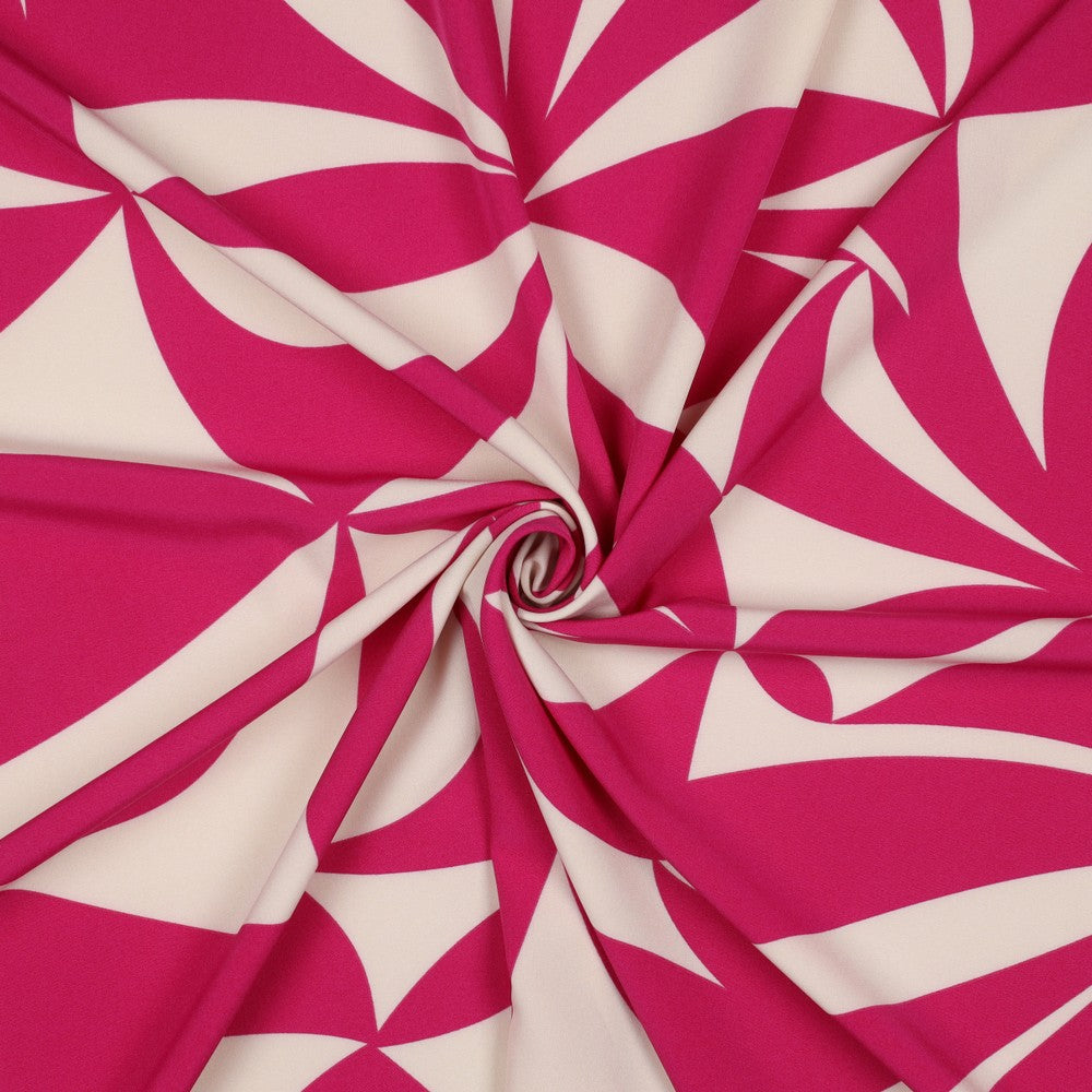 Magnolia stretch stof met geometrische print in de kleuren fuchsia en offwhite.