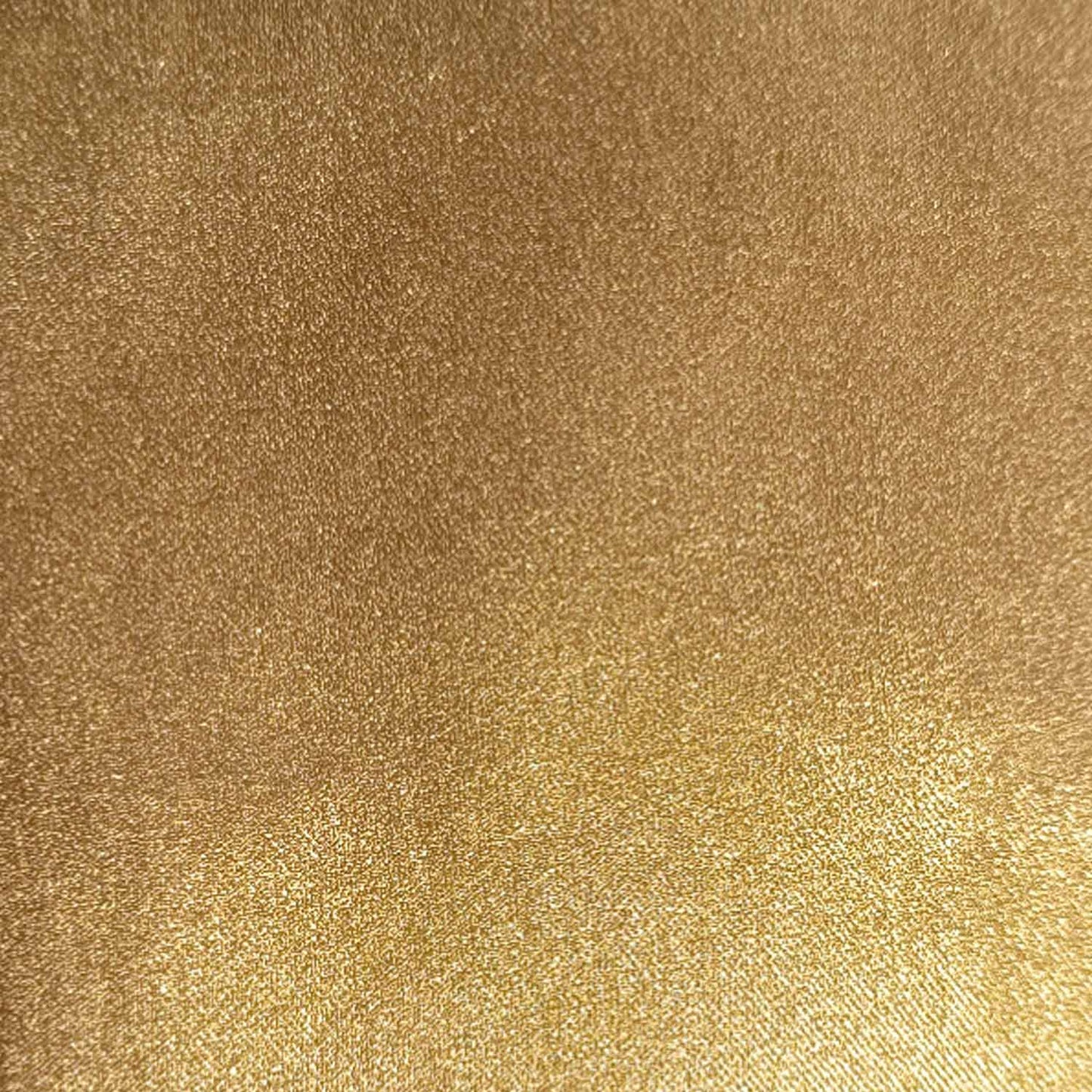 Metallic stretch stof van onder andere viscose in de kleur goud.