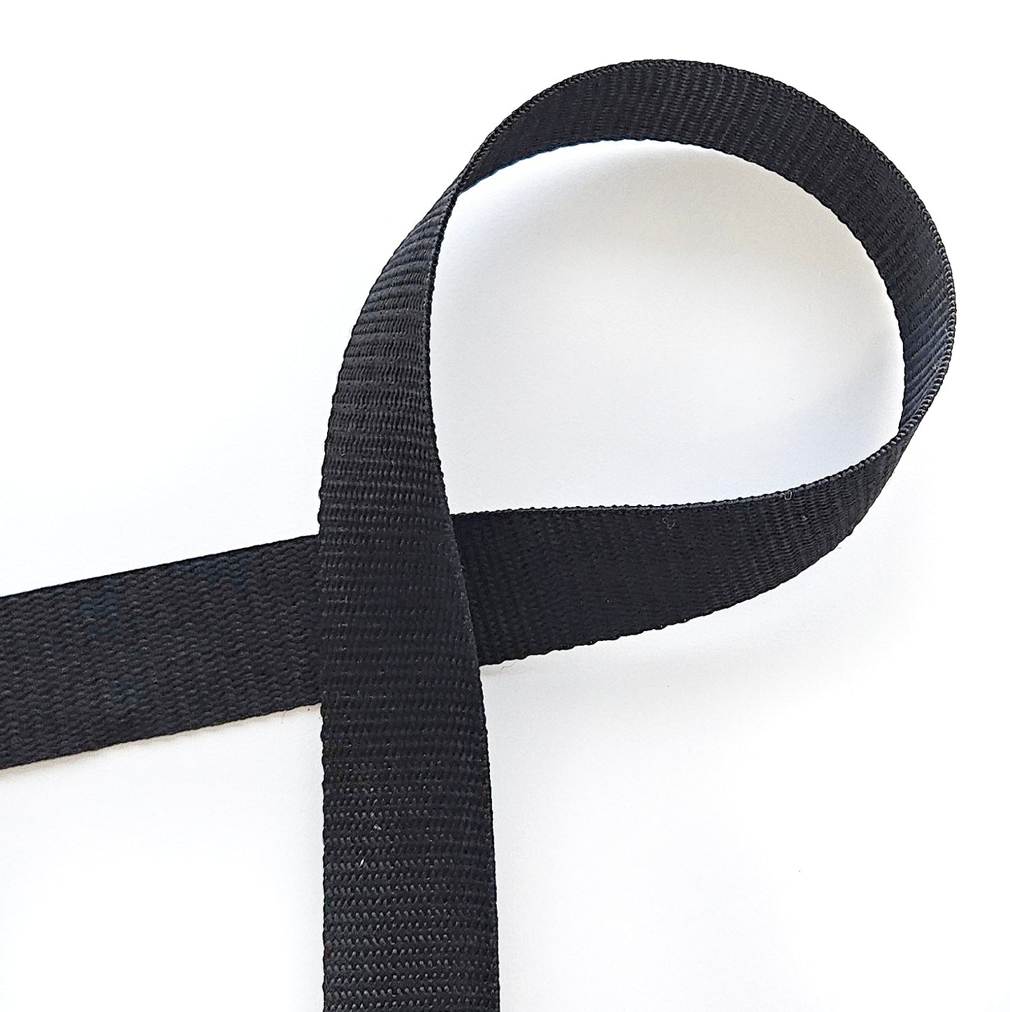 Zwart nylon tassenband.