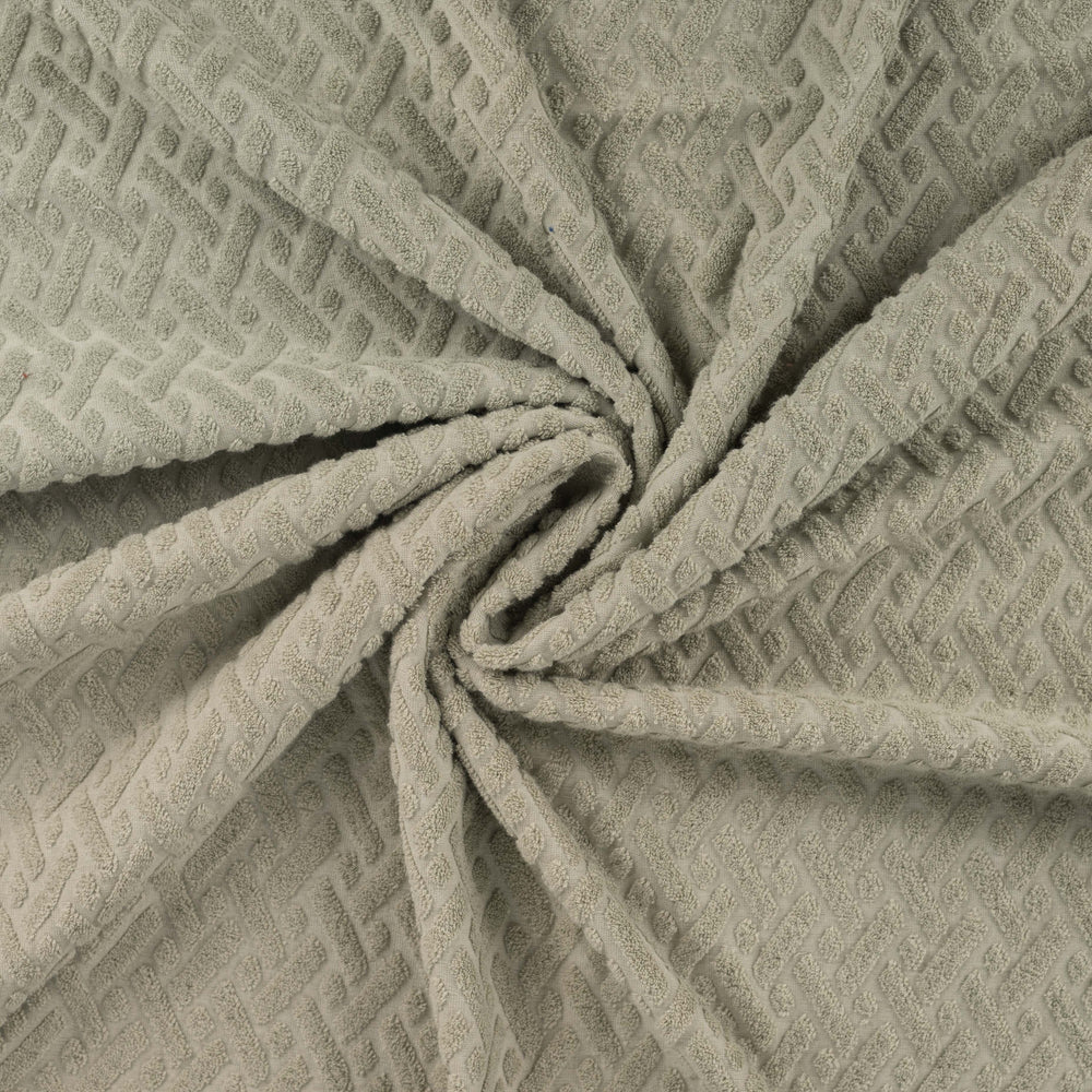 Badstof met stretch jacquard kaki groen grafisch.