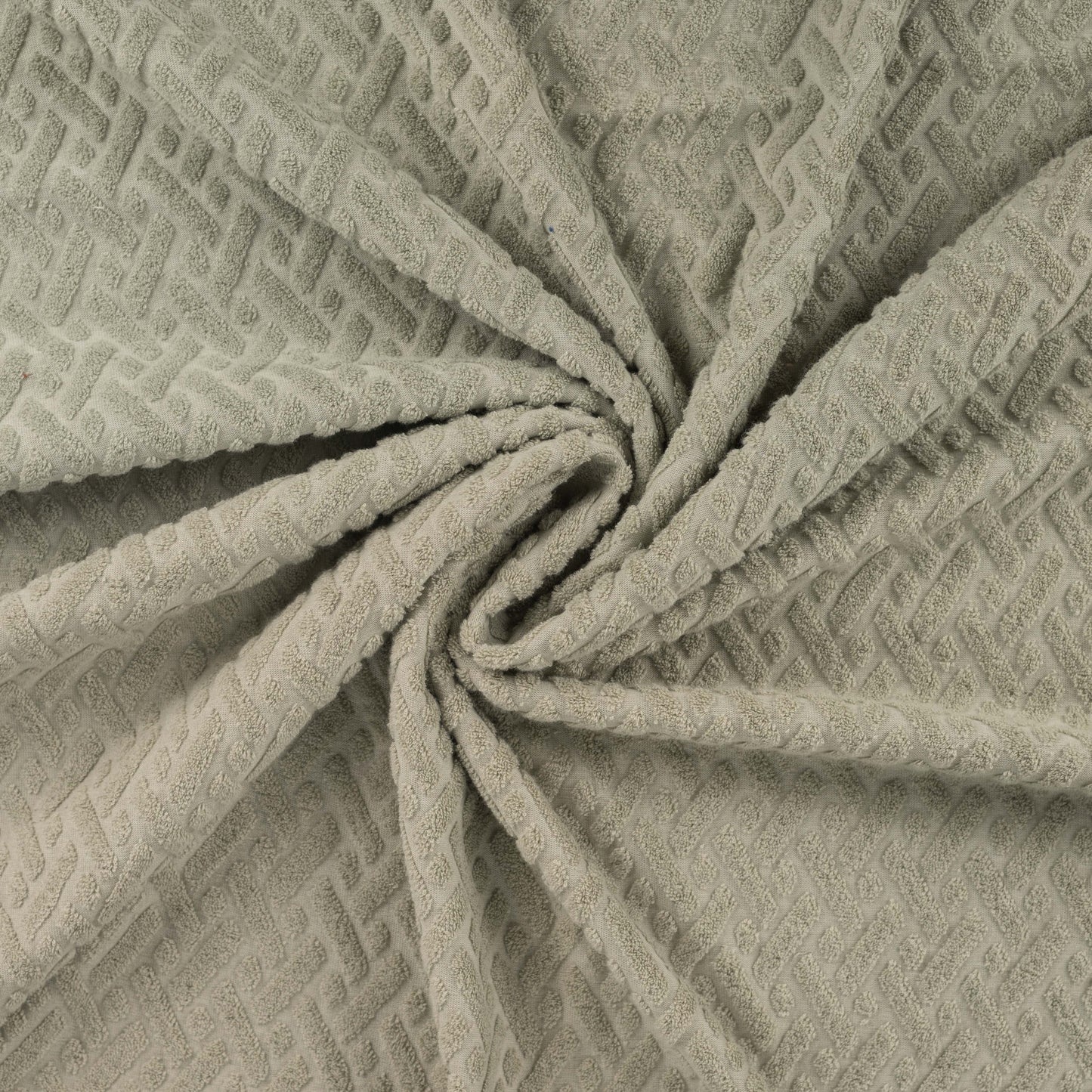 Badstof met stretch jacquard kaki groen grafisch.