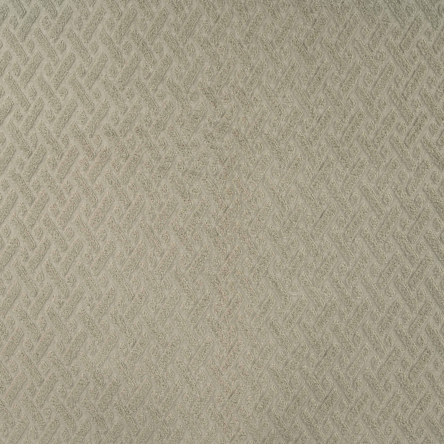 Rekbare badstof jacquard kaki met grafische print.