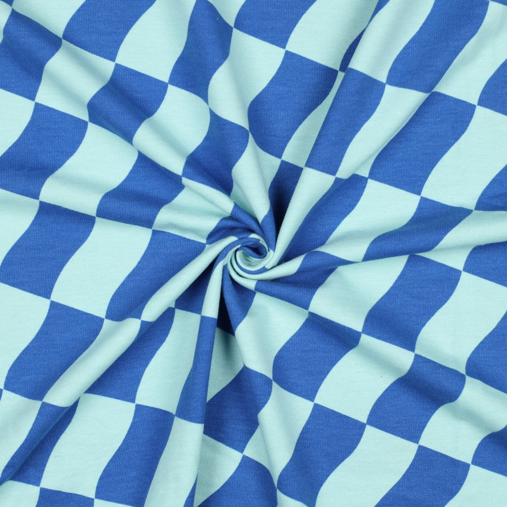 French terry met blauw en mint kleurige blokjes.
