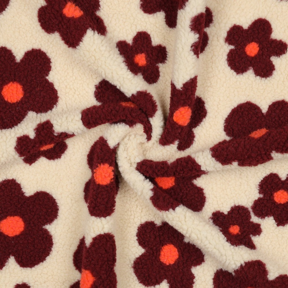 Beige teddy stof met grote bloemen in de kleuren wijnrood en neon oranje.