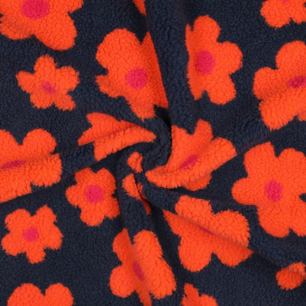 Teddy stof navy blauw met knaloranje grote bloemen.