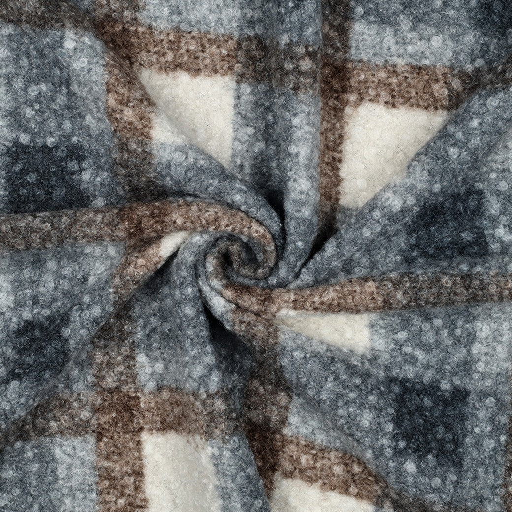 Geruit boucle stof in de kleuren blauw bruin en offwhite