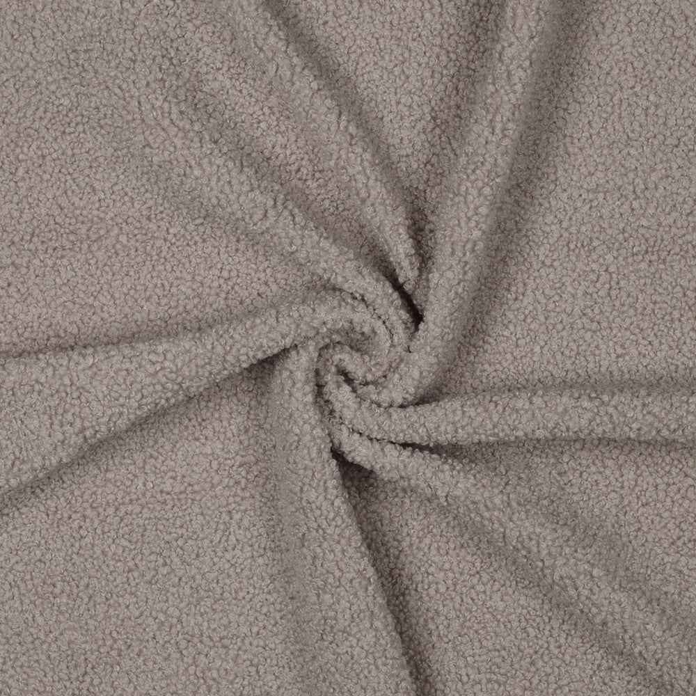 Zachte teddy faux fur in de kleur beige.