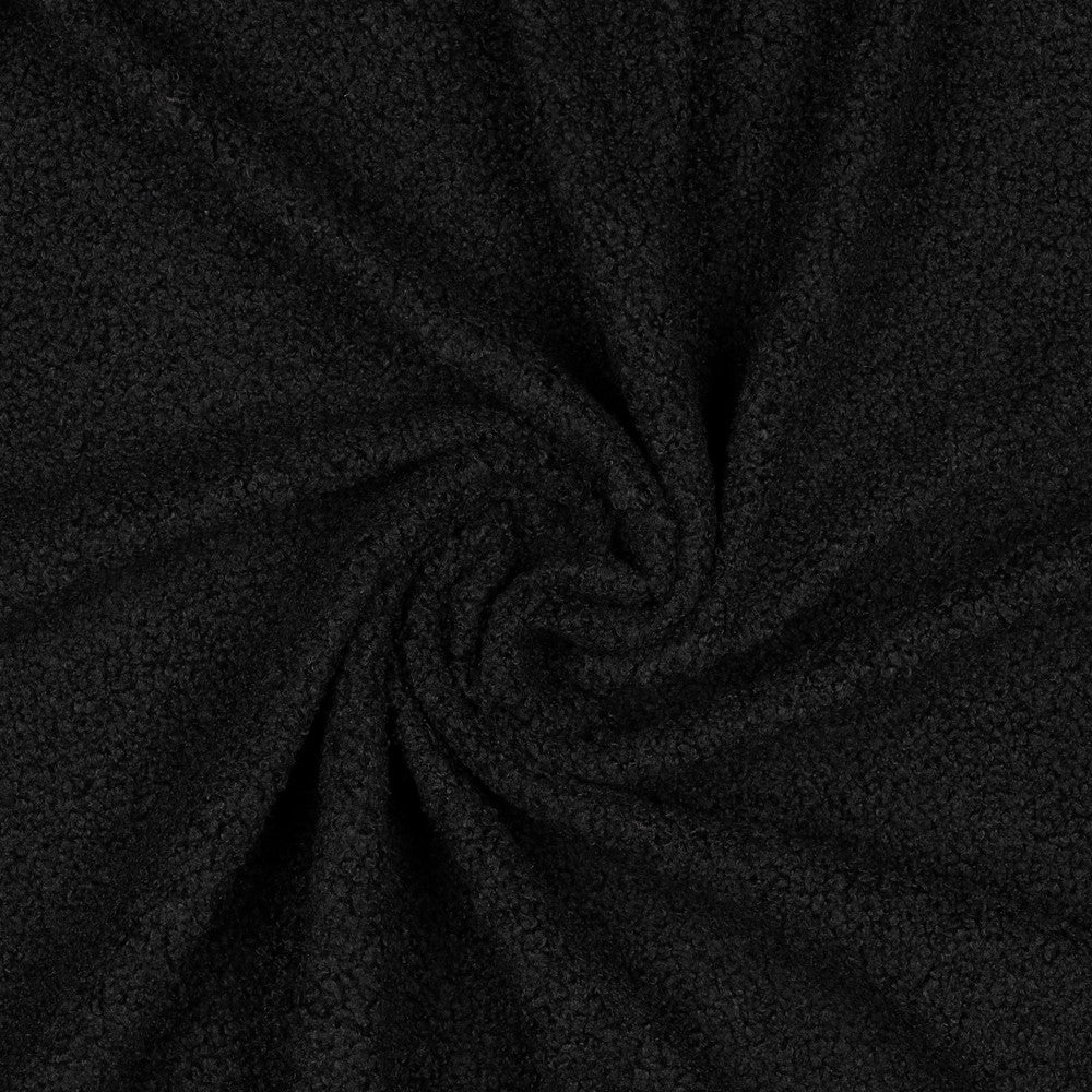 Zachte teddy faux fur in de kleur zwart.