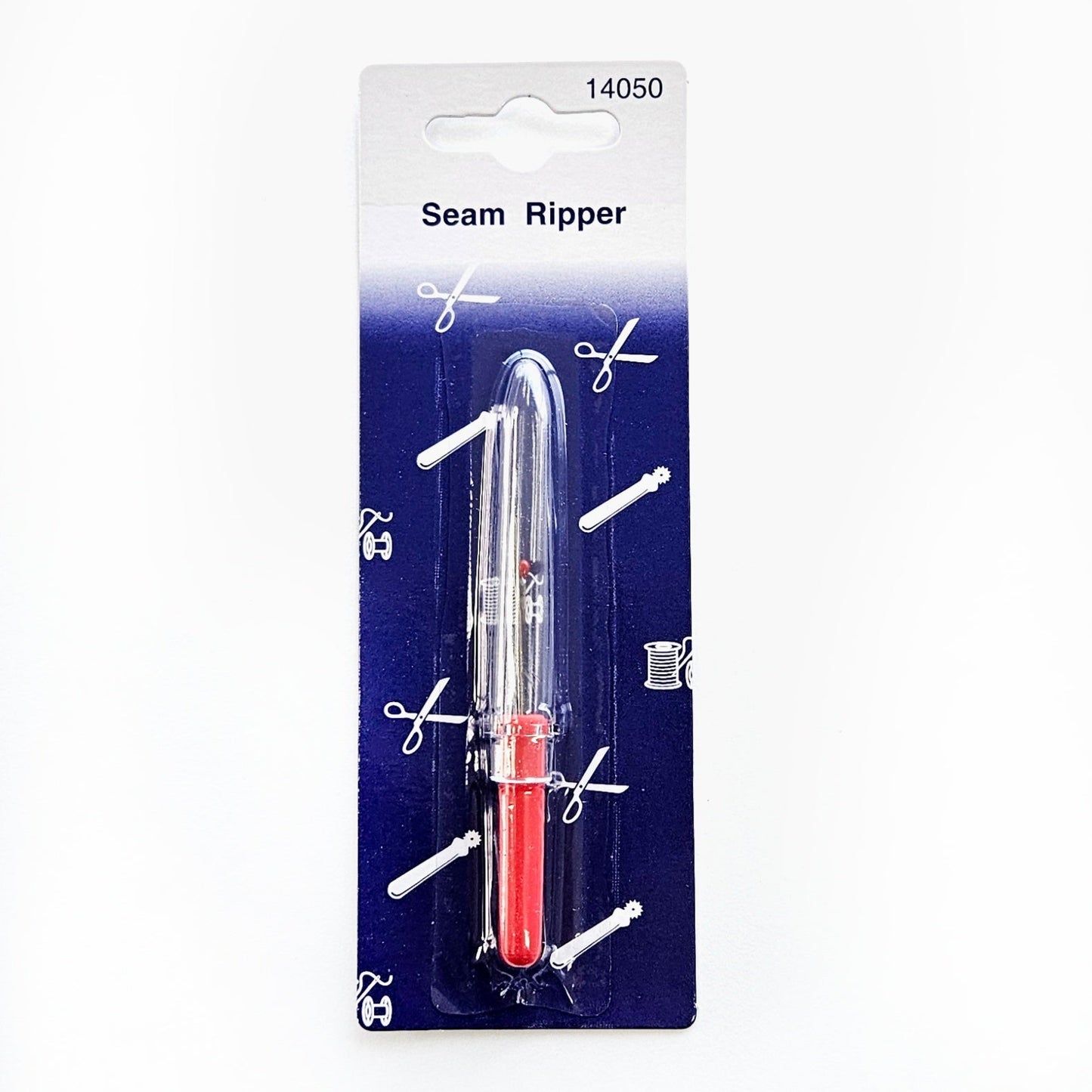 Klein rood tornmesje met dop in verpakking.