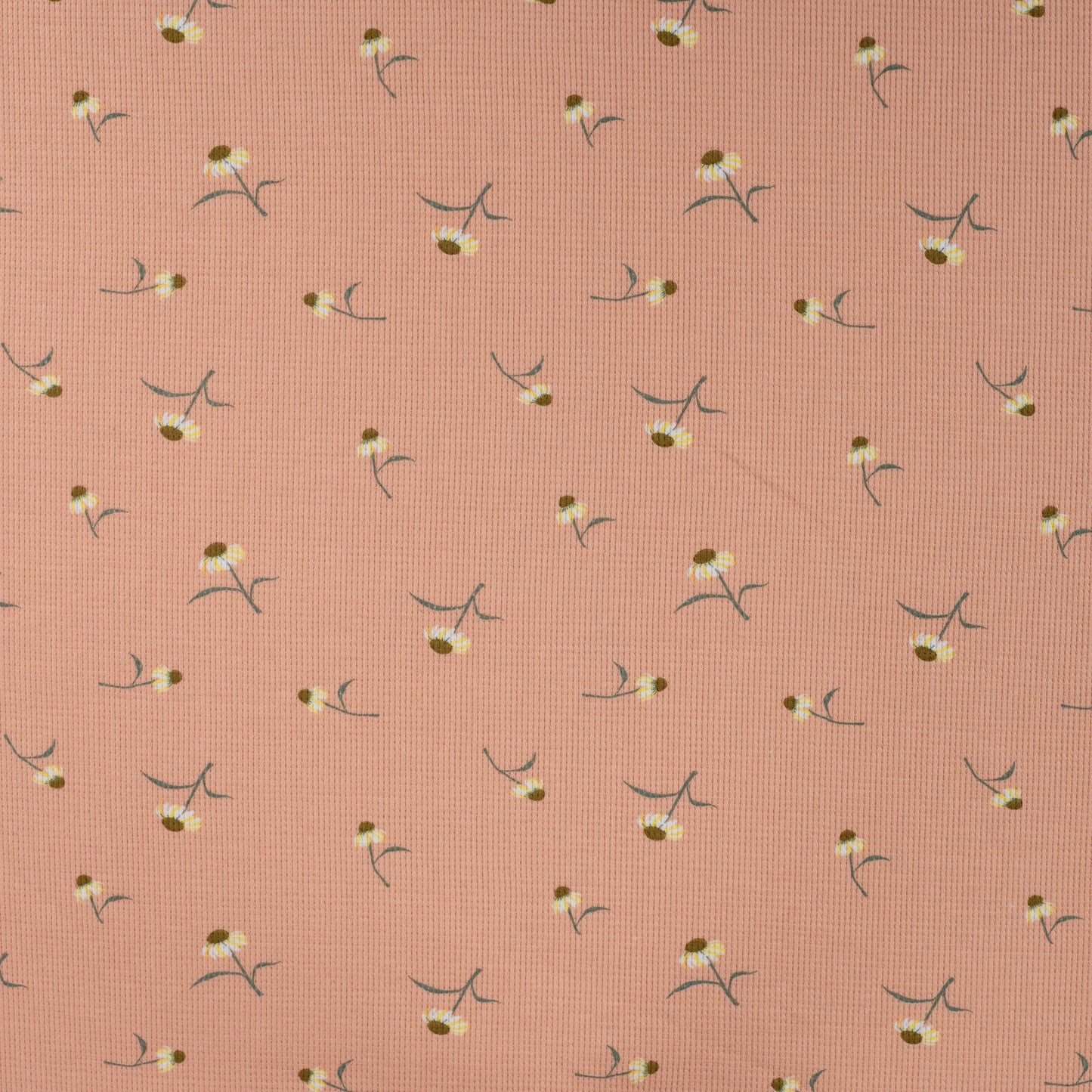 Wafel tricot stof zalmroze met schattige bloemetjes voor het maken van babykleding en kinderkleding.