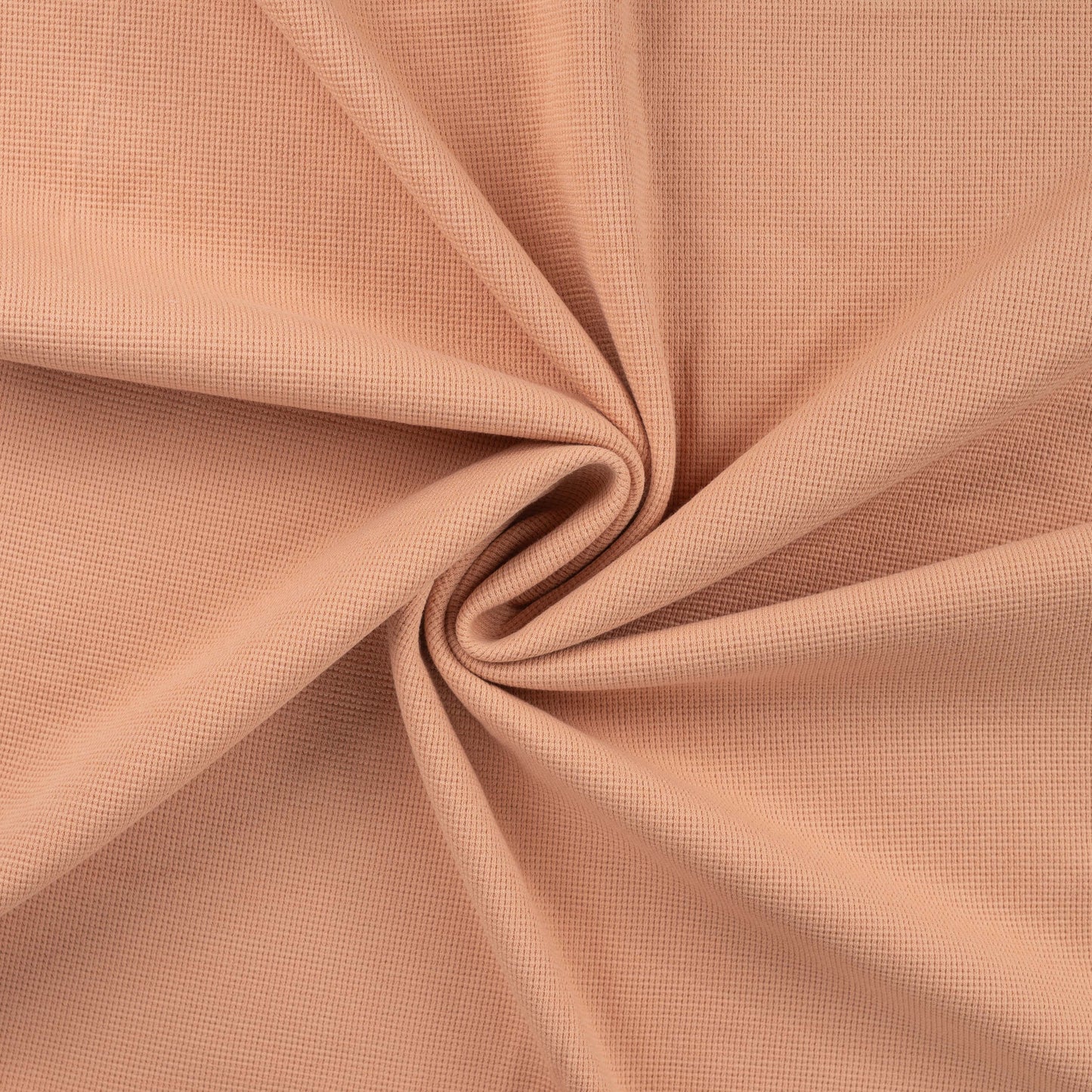 Wafeltricot jersey stof zalmroze voor bijvoorbeeld babykleding.
