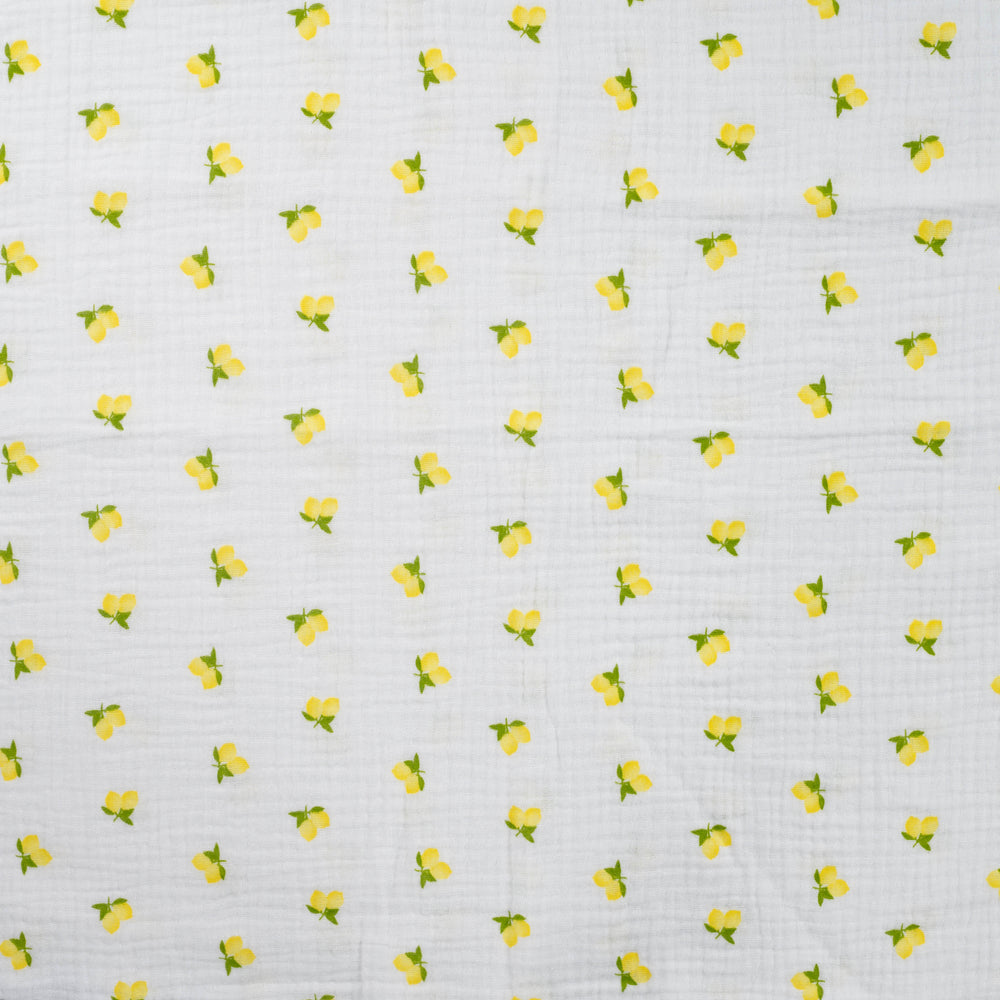 Witte mousseline met citroenen voor bijvoorbeeld babykleding.