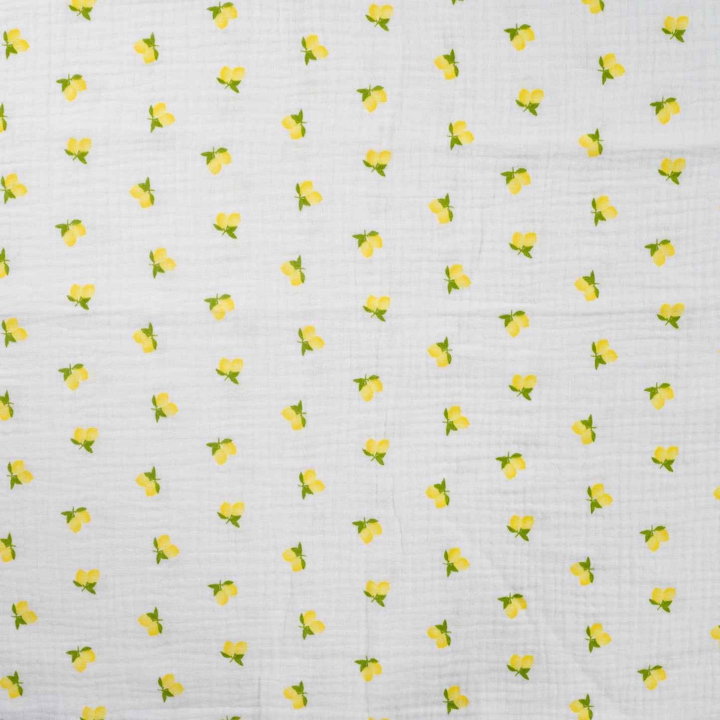 Witte mousseline met citroenen voor bijvoorbeeld babykleding.