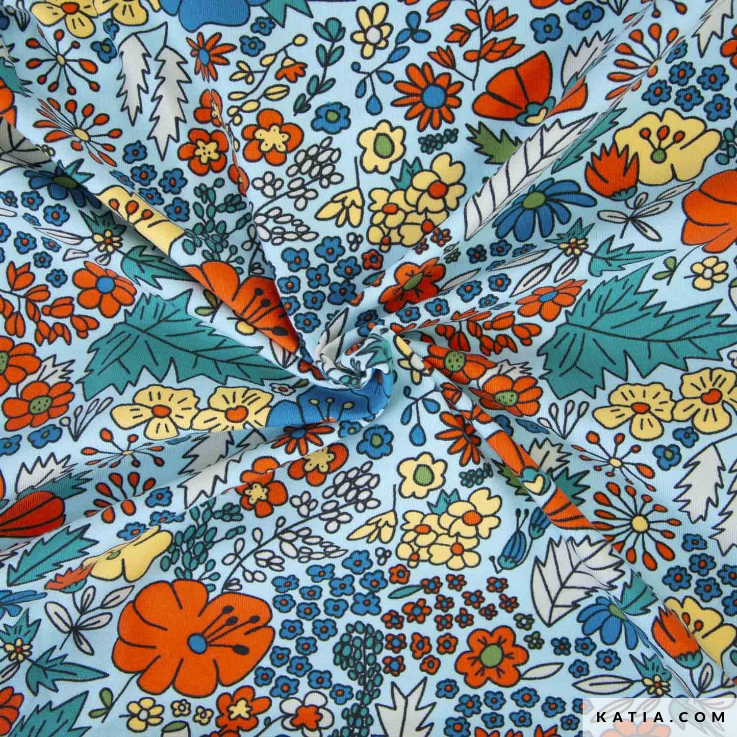Lichtblauwe tricot met gele blauwe en oranje bloemen.