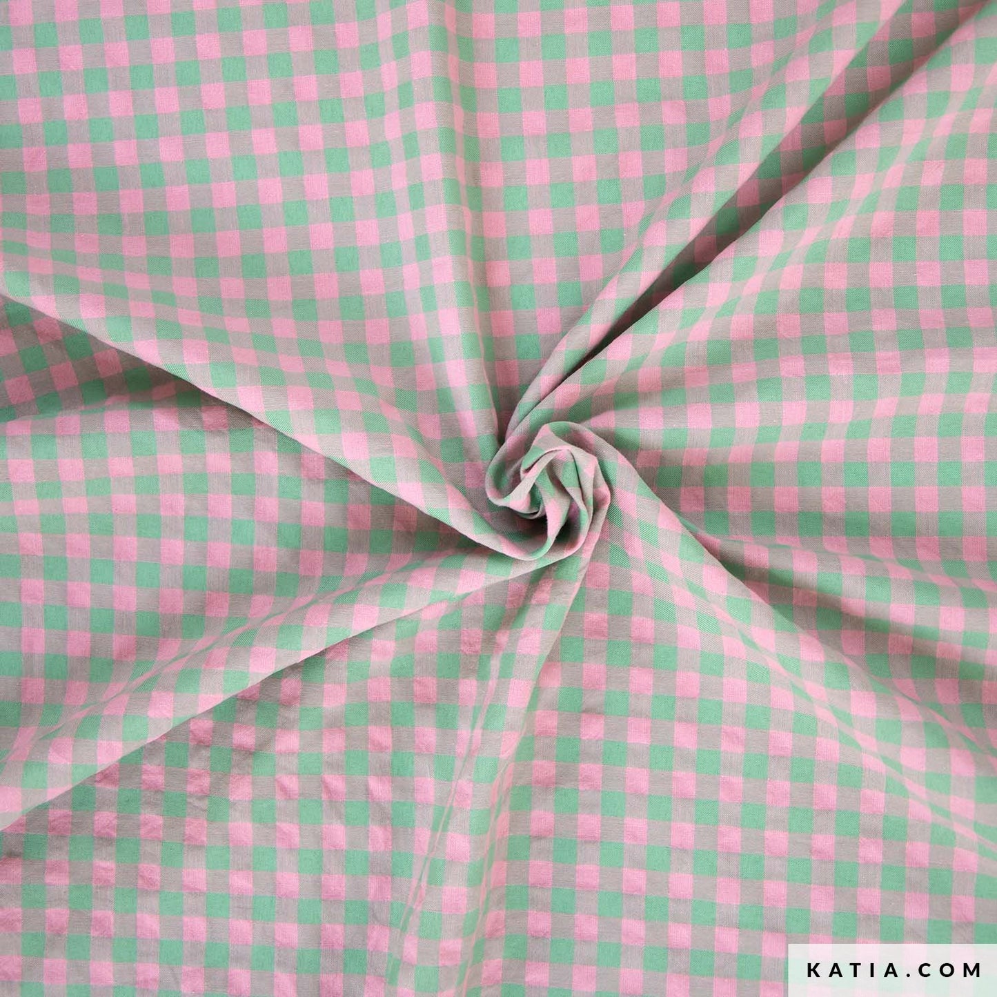 Tweekleurige katoen polyester stof met roze en groene ruitjes.